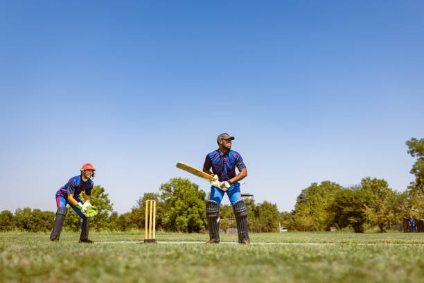 istock Cricketers in Action on a Sunny Day 2180256209