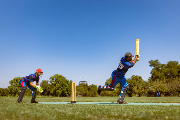 istock Cricketer Hitting The Ball Mid-Air On Field On A Sunny Day 2180256219
