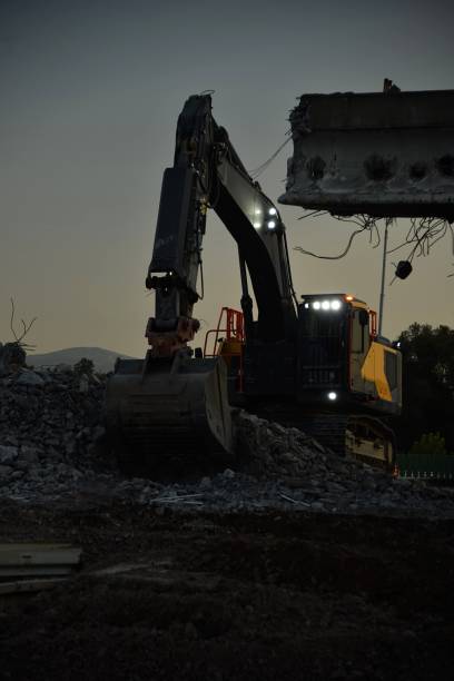 istock demolition of the bridge with construction equipment 2180256457