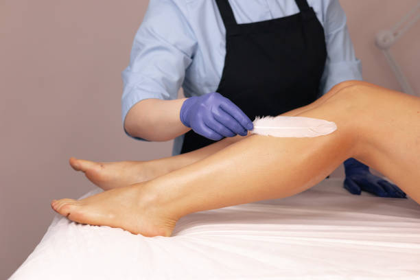 istock Aesthetic leg waxing process with gentle techniques in a tranquil beauty salon setting 2180258829