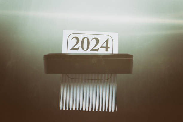 istock Goodbye to the Year 2024 in Paper Shredder 2180261184