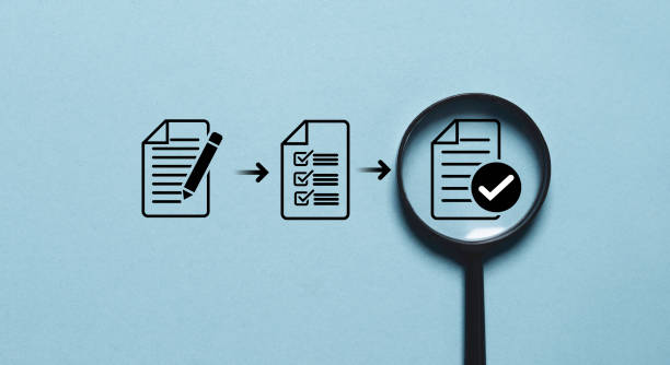 istock Document with correct sign mark inside of magnifier glass for prepare check and approve document , ISO quality control and assurance concept. 2180261273