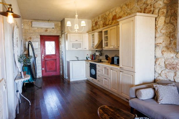 Interior of kitchen in vintage rustic style with wooden furniture in a cottage, family house.