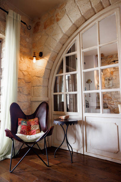 istock Cozy corner in rustic house with beautiful white indoor arched door 2180265588