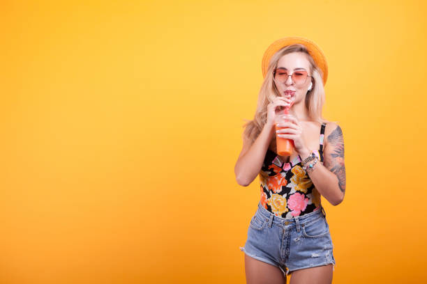 istock Woman enjoying fresh orange juice 2180266056