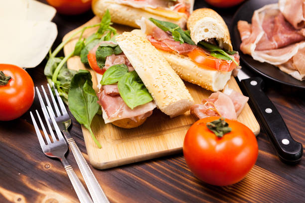 Homemade Italian Caprese sandwiches with fresh tomatoes, mozzarella cheese and basil