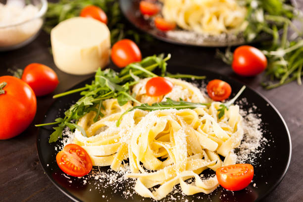 Close up of plate with tagliatelle pasta with cheese