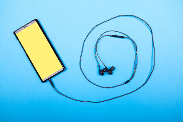 istock Miodern smartphone connected to headphones 2180276009