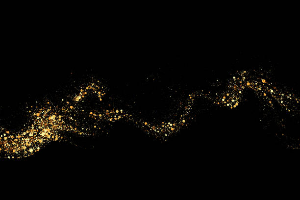 istock Texture of gold glitter, on a black background. Abstract golden color particles, confetti glitter explosion. Festive background. 2180277235