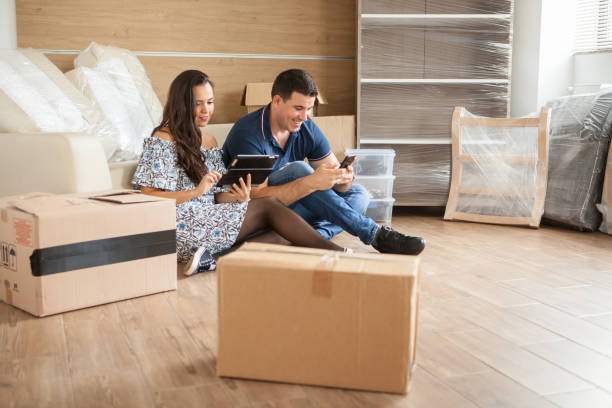 istock Happy couple thinking about decoration in new home 2180277887