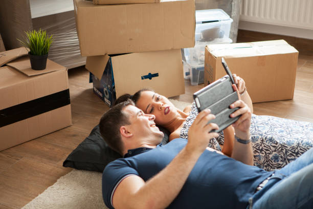 istock Happy couple lying on the floor after moving in . 2180279005