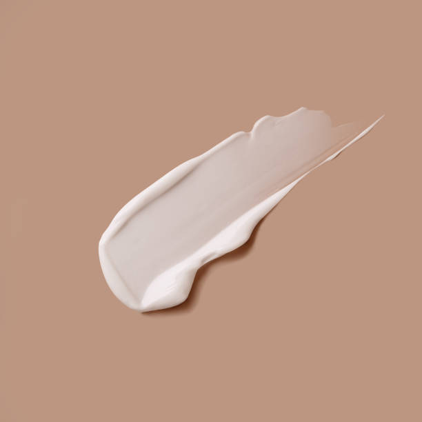 istock White cosmetic cream stroke isolated on body-color background 2180280043