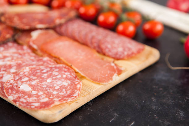 istock Meat appetizers next to tomatoes, radish and green onion 2180280390