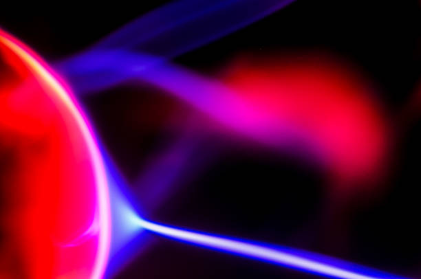 A colorful, abstract image with red, blue, and purple hues. The image is a representation of a light show or a colorful explosion. The colors are vibrant and dynamic, creating a sense of energy