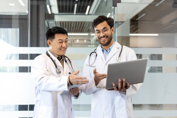 istock Two doctors collaborating on a project using a laptop in a modern medical office 2180283915