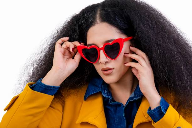 istock Model with red heart glasses 2180284051