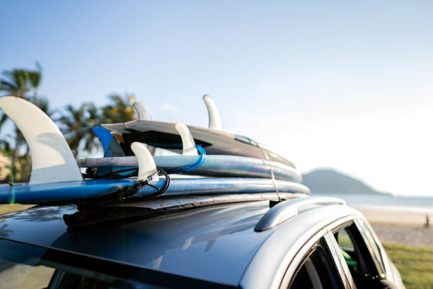istock Surfboard on top of the car 2180287733