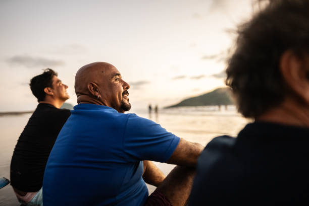 Senior man contemplating looking away on the beach