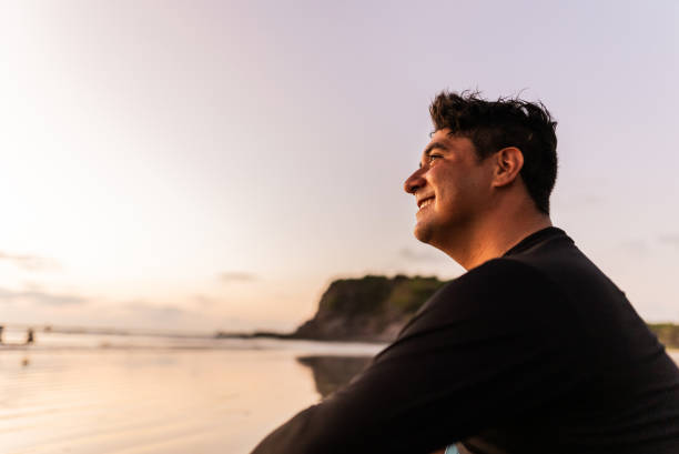 istock Mid adult man contemplating at beach 2180288062