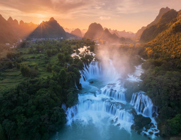 istock Ban Gioc waterfall in beautiful sunset 2180288159