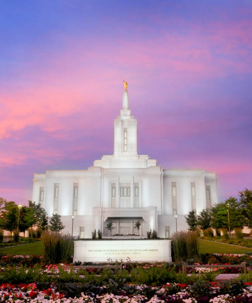 istock Pocatello LDS Mormon Latter-Day Saint Temple at Sunset with Glowing Lights 2180290643