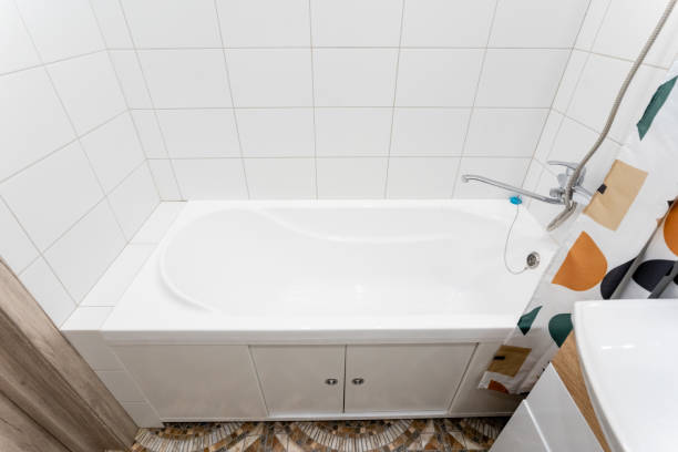 istock This elegantly designed bathroom features a relaxing bathtub, a convenient sink, and a stylish shower curtain, merging aesthetics with functionality for a cozy experience 2180291315