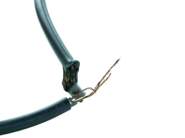 istock Old black electrical wire is damaged isolated on white background with clipping path. 2180293675