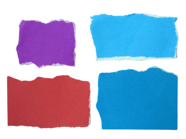 istock Several pieces of multi-colored torn-edge paper isolated on white background with clipping path. 2180295297
