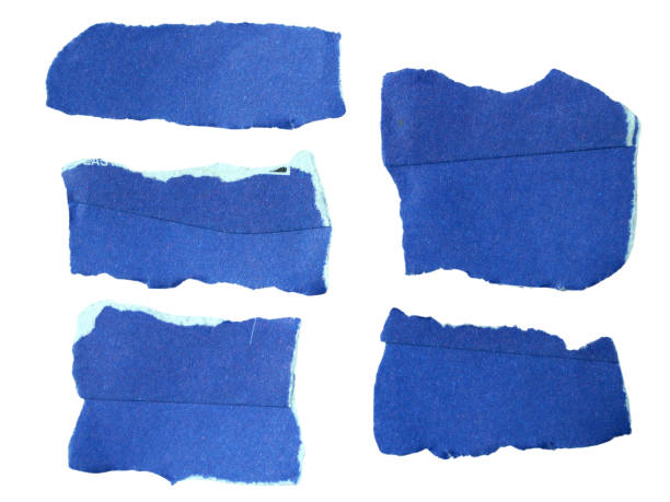 istock Several pieces of  blue torn-edge sticky notes isolated on white background with clipping path. 2180295372