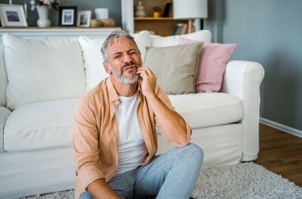 istock Mature man suffering from toothache 2180298483