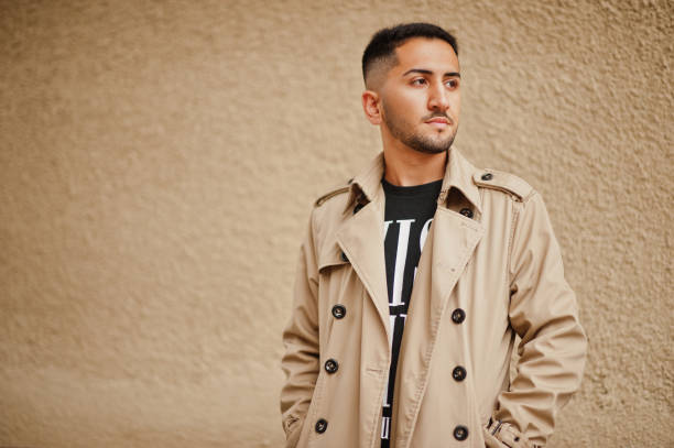 istock Stylish kuwaiti man at trench coat. 2180299789