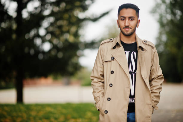istock Stylish kuwaiti man at trench coat. 2180299803