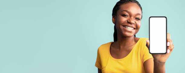 istock Lady Showing Smartphone Blank Screen Over Blue Studio Background, Mockup 2180300254