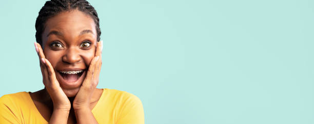 istock Excited Black Lady Screaming Touching Face Posing Over Blue Background 2180300269