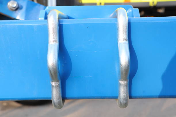 istock CloseUp of Blue Metal Hook Connectors Specifically Attached to a Machinery Frame Structure 2180302299