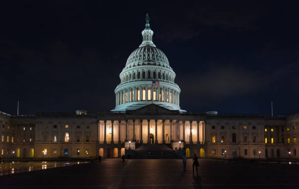 istock Front view of United States Capitol at night 2180303562