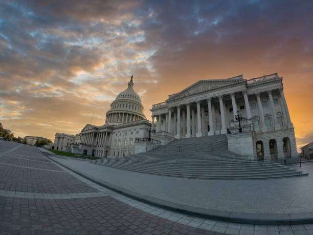 istock Dramatic sky over United States Capitol at sunset 2180304568
