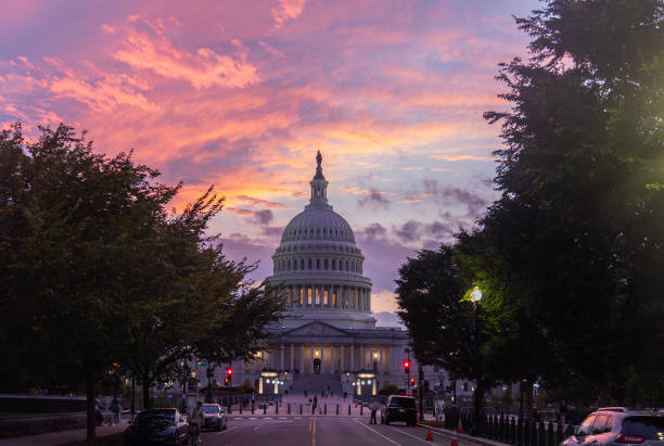 istock Colorful and dramatic sky over United States Capitol at sunset 2180304694