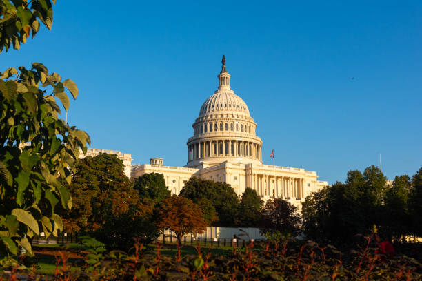 istock United States Capitol under a blue sky at sunset 2180304770
