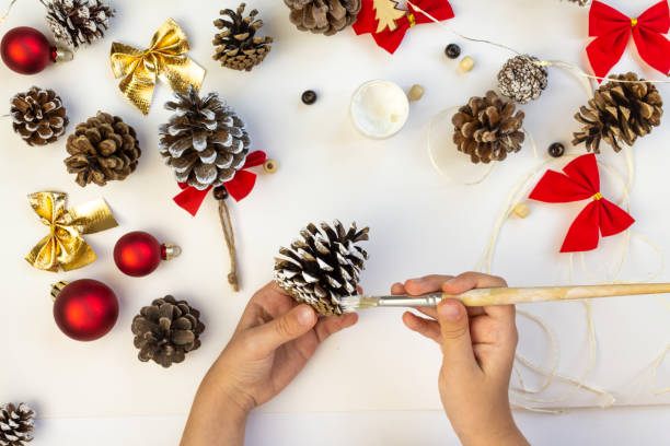 istock A child makes Christmas decorations with his own hands. 2180305039