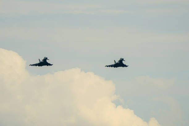 Russian Jet fighters flying over clouds. SU-35 jet fighter.