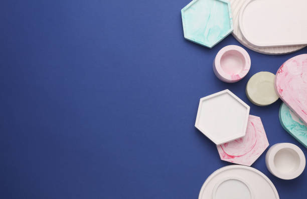 istock Plaster geometric shapes, decorative trays on blue background. Top view. Copy space 2180305301