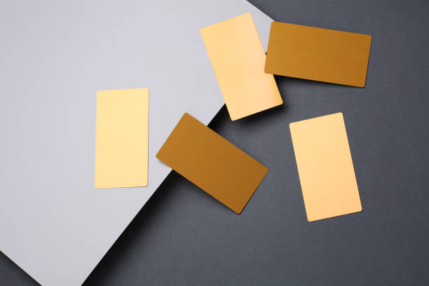 istock Gold business cards on a gray background 2180305558
