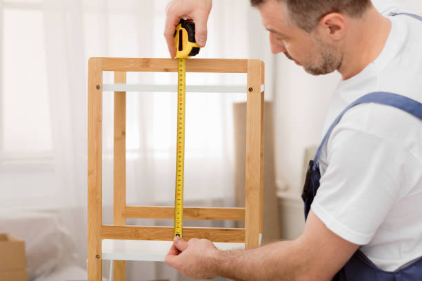 istock Professional Carpenter Measuring Shelf With Tape Working Indoor 2180306194