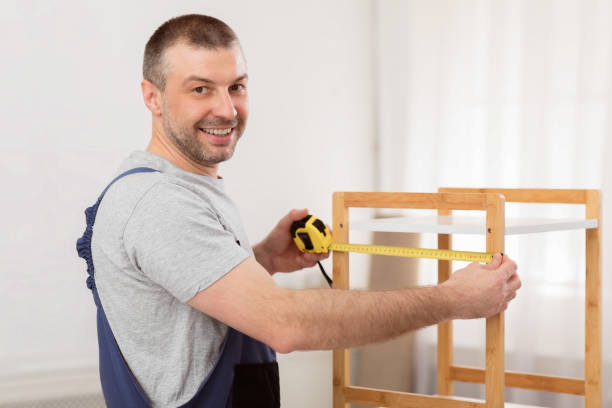 istock Mature Man Making Wooden Shelf Smiling To Camera Indoors 2180306221