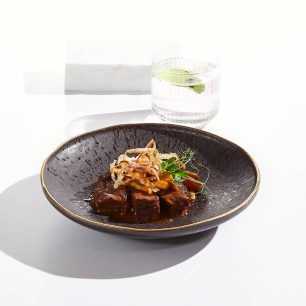 Elegant Beef Fillet with Mushroom Sauce in Minimalist White Setting