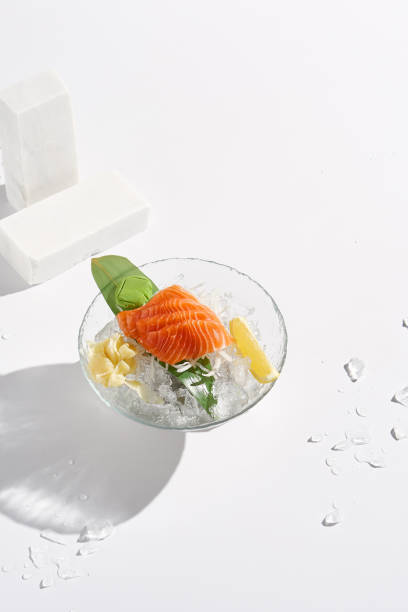 istock Minimalist Salmon Sashimi on Ice with Clean White Background 2180308597