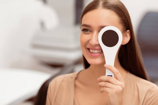 istock Patient and optician doing eye test in clinic 2180309077