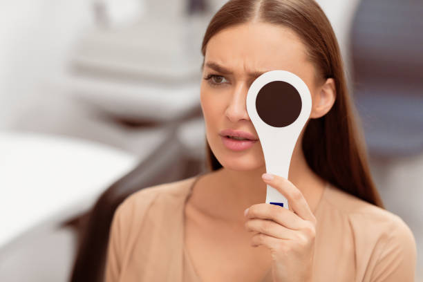 istock Patient and optician doing eye test in modern clinic 2180309082