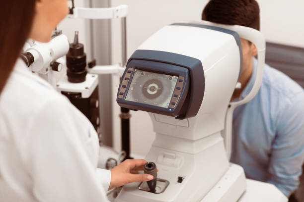 istock Optometrist checking patients vision at modern clinic 2180309095